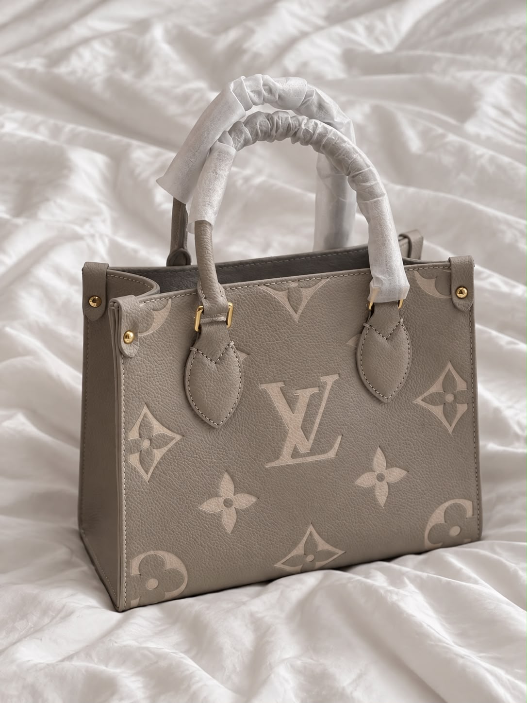 Lv On The Go PM Handbag