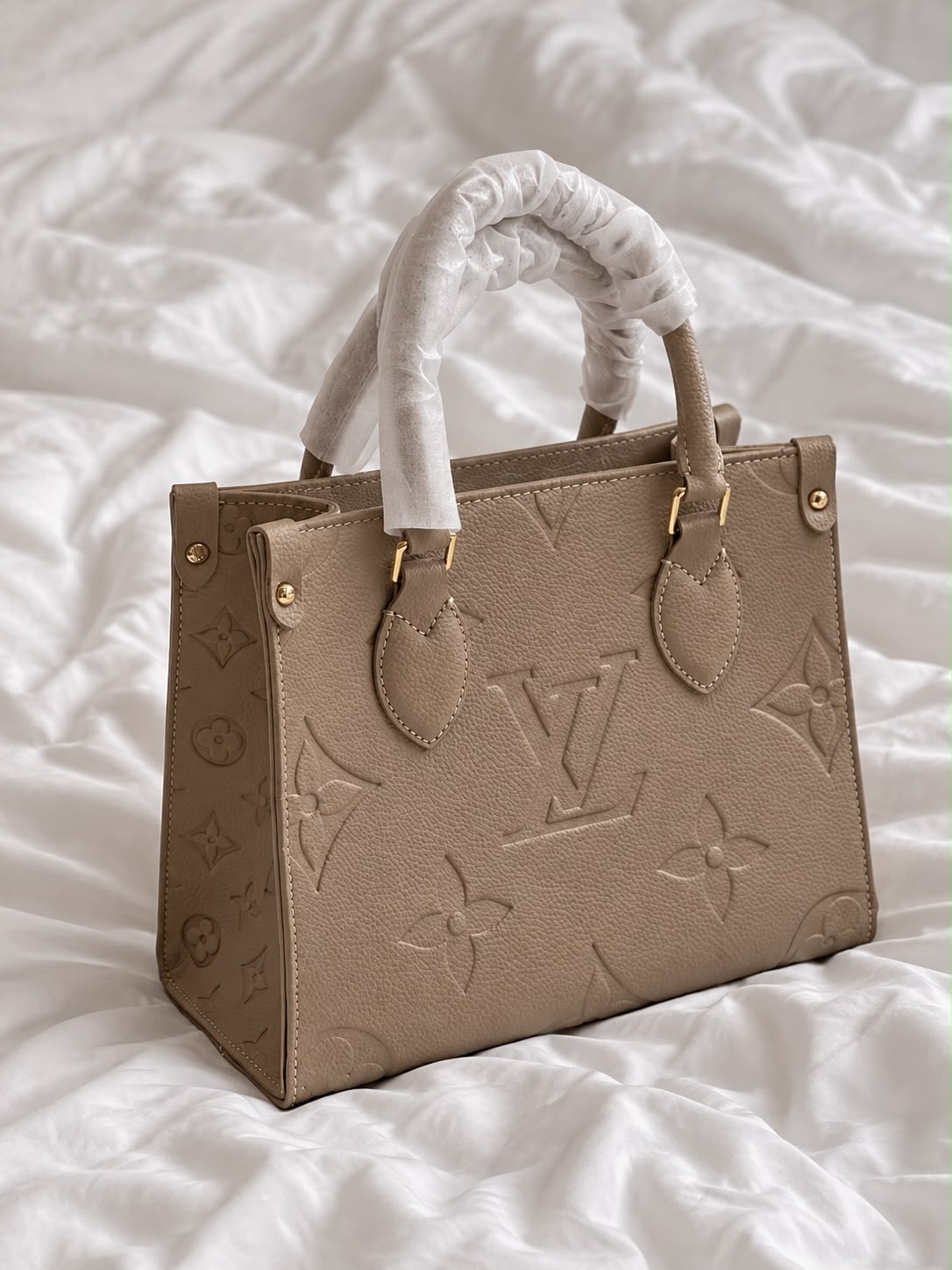 Lv On The Go PM Handbag
